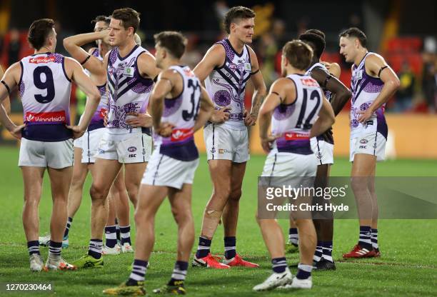 The Dockers walk off the ground after they were defeated by the Tigers during the round 15 AFL match between the Richmond Tigers and the Fremantle...