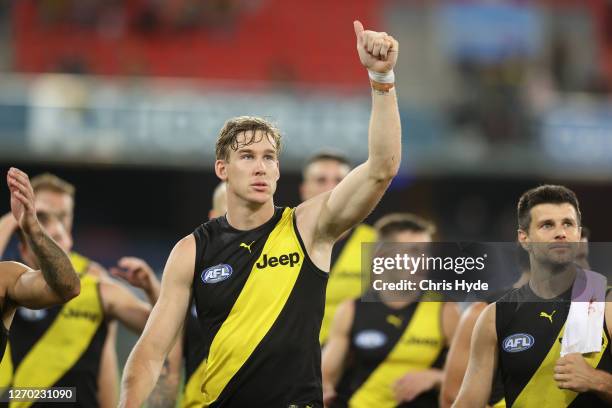 Tom J. Lynch of the Tigers waves to fans after the Tigers defeated the Dockers during the round 15 AFL match between the Richmond Tigers and the...