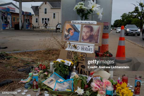 Small memorial decorates a lamp post near where Joseph Rosenbaum and Anthony Huber, two supporters of the Black Lives Matter movement, were shot and...