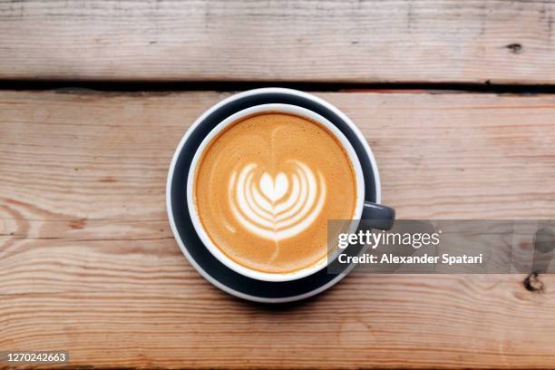 directly above view of a coffee cup with latte art - coffee heart stock pictures, royalty-free photos & images