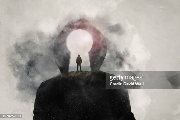 a mental health, wellness concept. a mans head covered in clouds. with a double exposure of a mans silhouette and keyhole over layered on top. - brain fog stock pictures, royalty-free photos & images