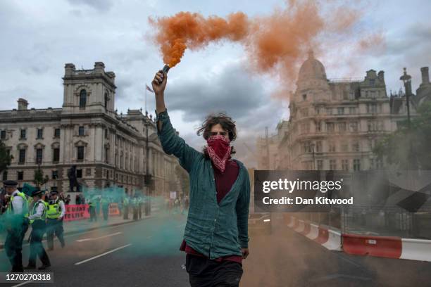 Extinction Rebellion protesters gather in Parliament Square during a climate change protest on September 2, 2020 in London, England. The...