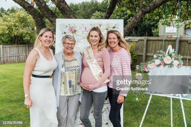three generations awaiting the fourth - outdoor baby shower stock pictures, royalty-free photos & images