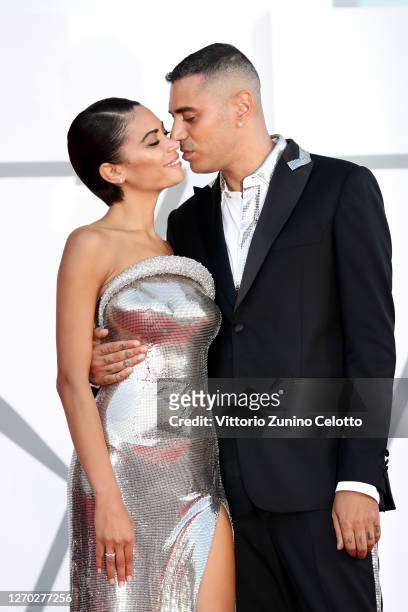 Marracash and Elodie walk the red carpet ahead of the Opening Ceremony and the "Lacci" red carpet during the 77th Venice Film Festival at on...