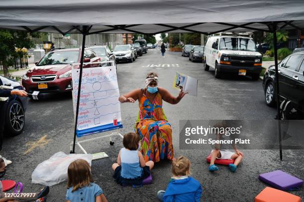 City council members, parents and students participate in an outdoor learning demonstration in front of a public school in the Red Hook neighborhood...