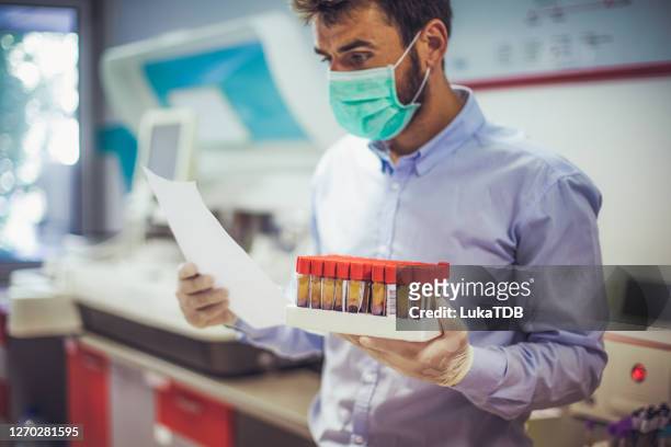 coronavirus testing - medical research paper stock pictures, royalty-free photos & images