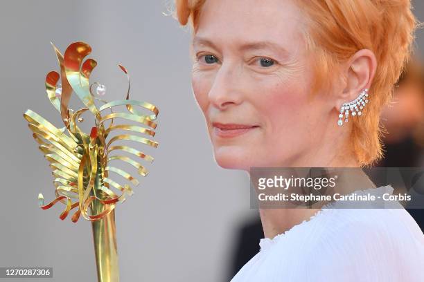 Actress Tilda Swinton walks the red carpet ahead of the Opening Ceremony and the "Lacci" red carpet during the 77th Venice Film Festival at on...