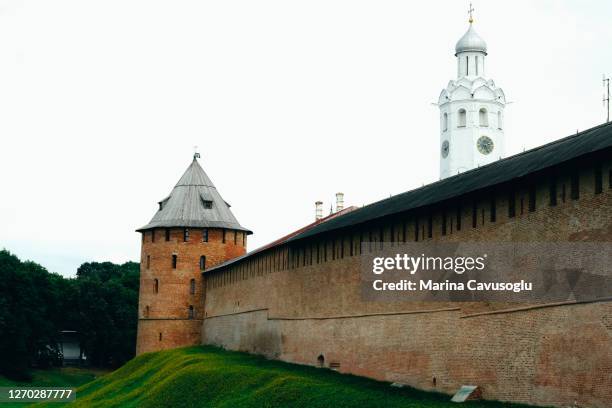 fortress wall and tower of ancient russian historical city velikiy novgorod. - novgorod stock pictures, royalty-free photos & images