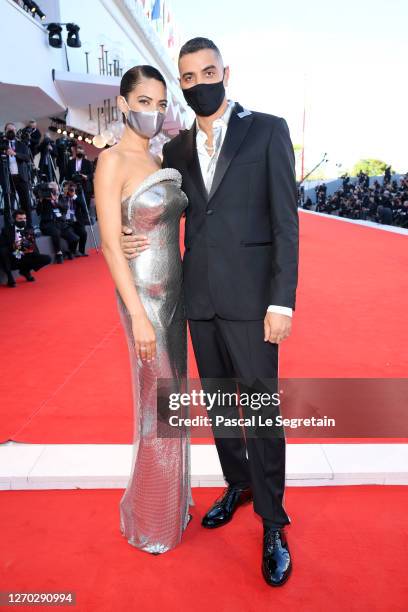 Elodie and Marracash walk the red carpet ahead of the Opening Ceremony and the "Lacci" red carpet during the 77th Venice Film Festival at on...