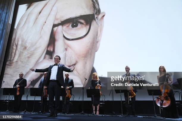 Roma Sinfonietta Orchestra directed by Andrea Morricone performs during the Opening Ceremony as a tribute to Ennio Morricone during the 77th Venice...
