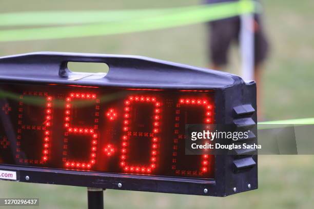 finish line clock at a marathon running race - sports scoring stock pictures, royalty-free photos & images