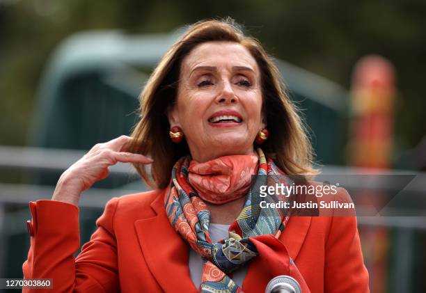 Speaker of the House Nancy Pelosi adjusts her hair as she speaks during a Day of Action For the Children event at Mission Education Center Elementary...