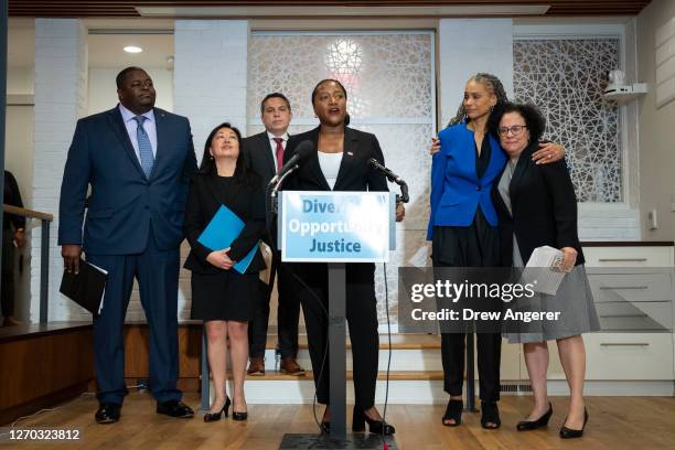 At center, Janai Nelson, president of the Legal Defense Fund, speaks during a news conference about the Supreme Court's affirmative action ruling...