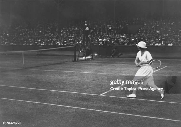 French tennis player Suzanne Lenglen in play at the Lawn Tennis Championships at Wimbledon, London, 1st July 1919. She won the Women's Singles title...