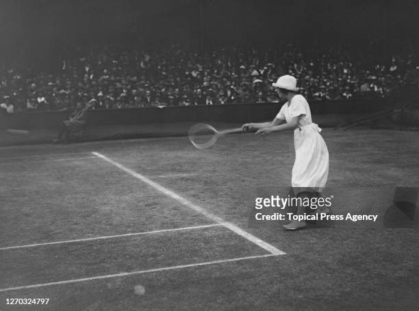 French tennis player Suzanne Lenglen in play at the Lawn Tennis Championships at Wimbledon, London, 1st July 1919. She won the Women's Singles title...