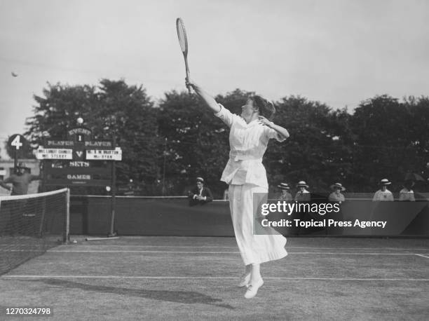American tennis player Elizabeth Ryan in play at the Lawn Tennis Championships at Wimbledon, London, June 1914. She is partnering Agnes Morton in a...