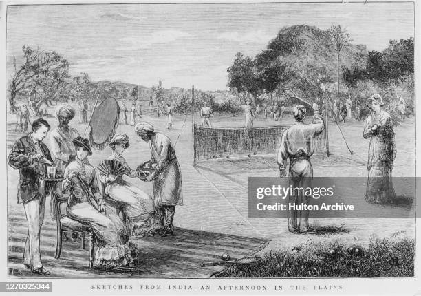 British people playing tennis in India, during the British Raj, while a khidmatgar or male waiter serves them tea, 1880. A sketch from the Graphic -...