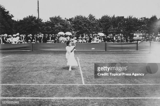 American tennis player May Sutton in play on Court 4 at Wimbledon, London, 1908. She is partnering Blanche Hillyard in a women's doubles match...