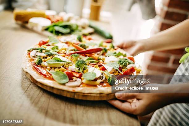 work of my hands - vegetarian pizza stock pictures, royalty-free photos & images