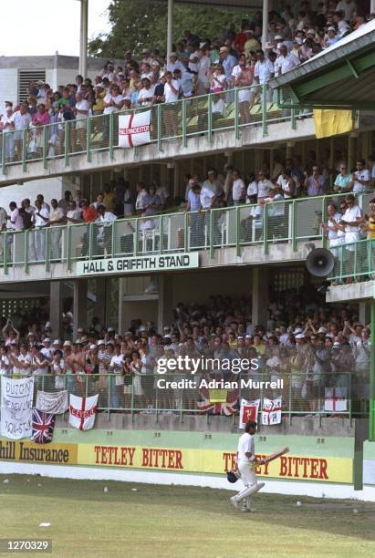 Allan Lamb of England is applauded as he leaves the pitch after his innings of 100 runs during the Fourth Test match against the West Indies at the...