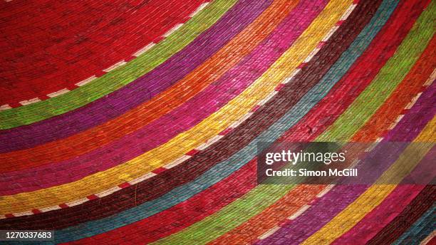 bright, multi-coloured striped woven mexican grass mat - mexican textile stock pictures, royalty-free photos & images