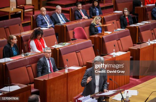 Senator Richard Colbeck, Minister for Aged Care and Senior Australians, listens to Senator Penny Wong, Leader of the Opposition in the Senate and...