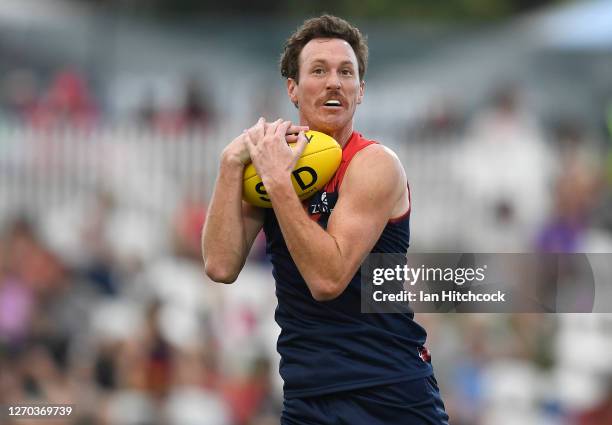 Mitch Brown of the Demons takes the ball during the round 15 AFL match between the Sydney Swans and the Melbourne Demons at Cazaly's Stadium on...