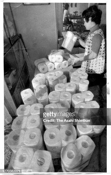 Woman stocks up with rolls of toilet paper during the oil crisis on October 29, 1973 in Nara, Japan.