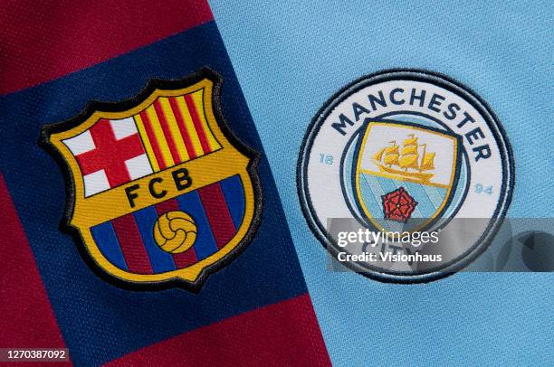 The FC Barcelona and Manchester City club crests on their first team home shirts on September 1, 2020 in Manchester, United Kingdom.