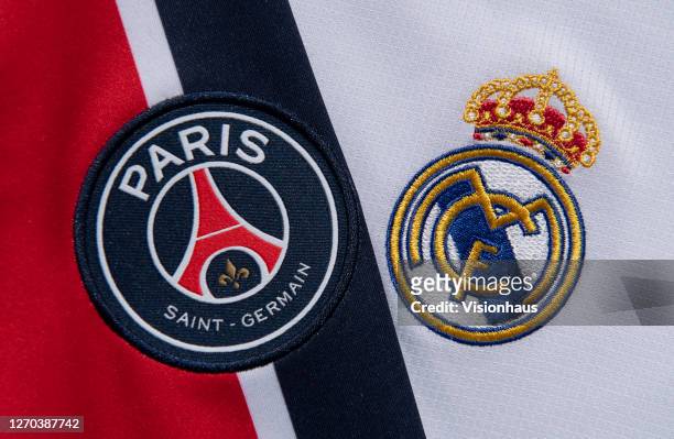 The Paris Saint-Germain and Real Madrid club crests on their first team home shirts on September 1, 2020 in Manchester, United Kingdom.