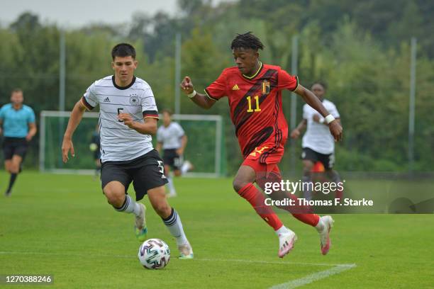 Micholas Engels of Germany and Samuel Mbangula Tshifunda of Belgium fight for the ball during the U17 international friendly match between Germany...