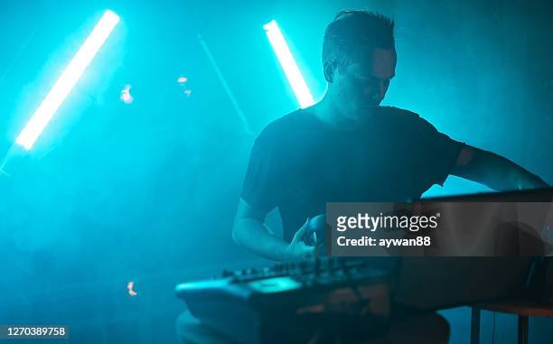 dj mixing at a party - dj stock pictures, royalty-free photos & images