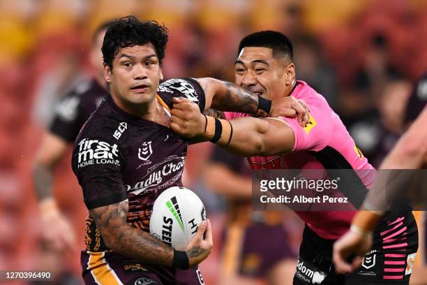Issac Luke of the Broncos is tackled during the round 17 NRL match between the Brisbane Broncos and the Penrith Panthers at Suncorp Stadium on...