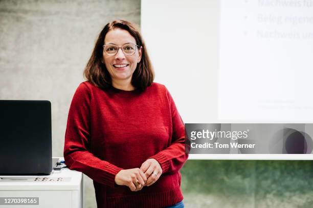 portrait of university tutor - red jumper stock pictures, royalty-free photos & images