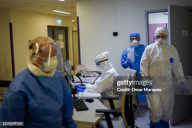 Medical personnel wear protective suits, masks, gloves and face shields during their shift inside the COVID 19 area at the Krakow University Hospital...