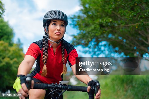 Female Bike Racing Rambling Rose A Female Cyclist Riding Racing Bike In Nature High-Res Stock Photo ...