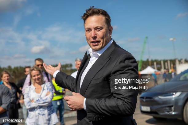 Tesla head Elon Musk talks to the press as he arrives to to have a look at the construction site of the new Tesla Gigafactory near Berlin on...