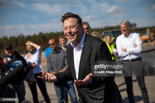 Tesla head Elon Musk talks to the press as he arrives to to have a look at the construction site of the new Tesla Gigafactory near Berlin on...