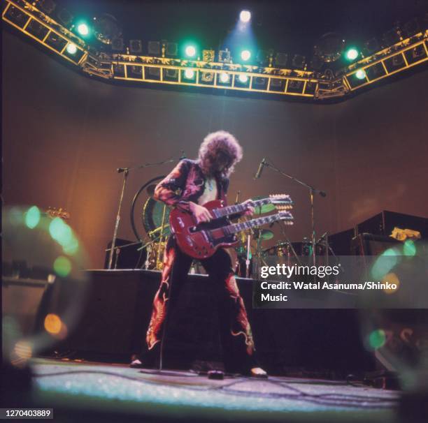 Jimmy Page of Led Zeppelin performing on stage at Earl's Court, London, May 1975. Jimmy Page is playing a Gibson EDS-1275 double necked guitar.