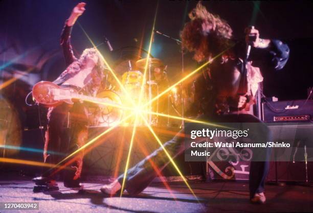 Jimmy Page , John Bonham , Robert Plant of Led Zeppelin performing on stage with Marshall amplifiers behind, at Earl's Court, London, May 1975.