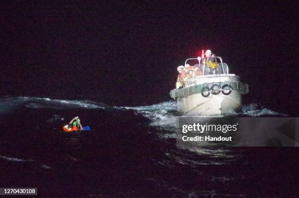 Sareno Edvarodo, a 45-year-old chief officer from the Philippines of the capsized ship 'The Gulf Livestock 1' is seen being rescued by Japan Coast...