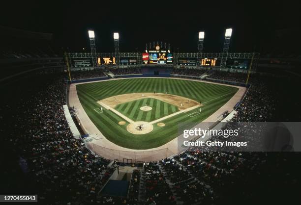 Fans and spectators of the Chicago White Sox watch the first Major League Baseball American League West night game at the new Comiskey Park stadium...