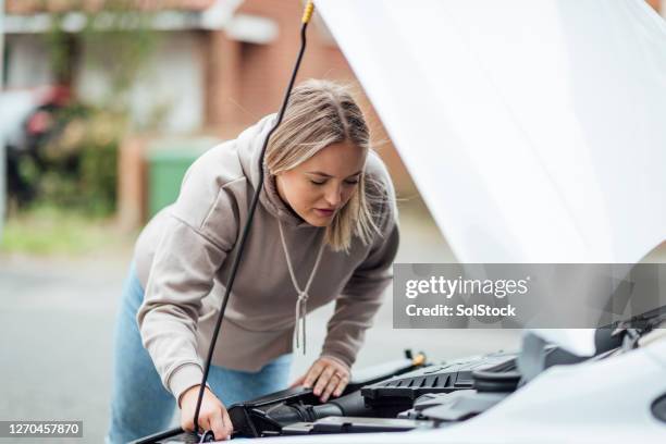 looking over the car engine - car inspection stock pictures, royalty-free photos & images