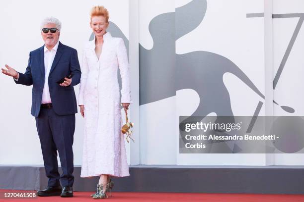 Tilda Swinton and Pedro Almodovar walk the red carpet ahead of the movie "The Human Voice" and "Quo Vadis, Aida?" at the 77th Venice Film Festival at...