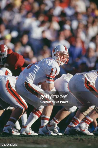 Jeff Brohm, Quarterback for the University of Louisville Cardinals calls the play on the line of scrimmage against the University of Alabama Crimson...