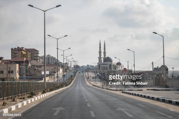 Main street is seen empty during a coronavirus lockdown on August 30, 2020 in Gaza City, Gaza. Fears are growing that the already crippled health...