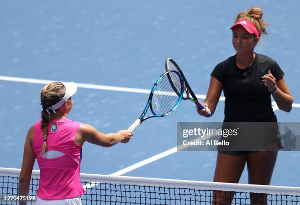 Amanda Anisimova of the United States taps rackets after winning against Katrina Scott of the United States during their Women's Singles second round...