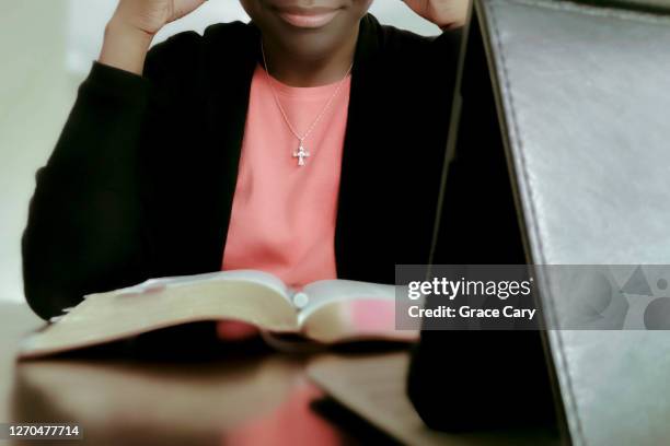 woman watches online church service - cross christianity stock pictures, royalty-free photos & images