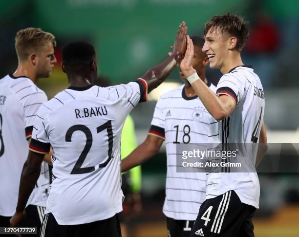 Nico Schlotterbeck of Germany U21 celebrates with teammate Ridle Baku of Germany U21 after scoring his team's third goal during the UEFA Euro Under...