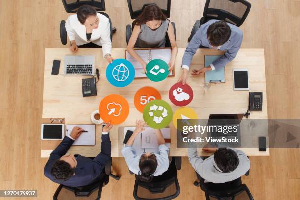 business people working face to face with symbolic icons - table of content stock pictures, royalty-free photos & images